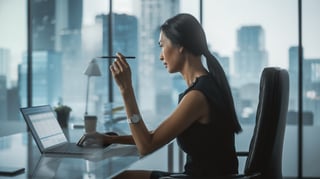 Businesswoman working on a laptop in an office