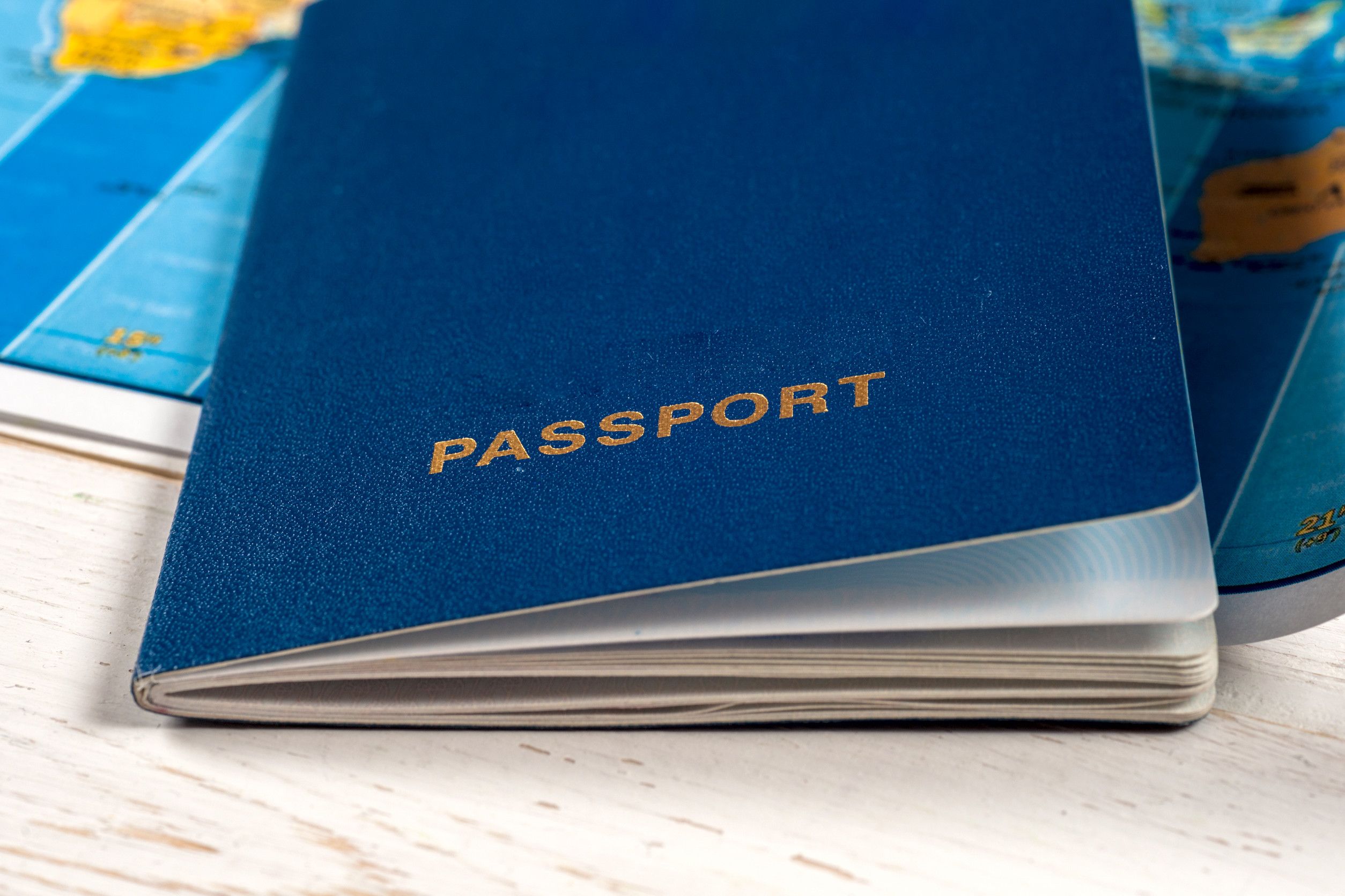 Closed Blue Passport On World Map