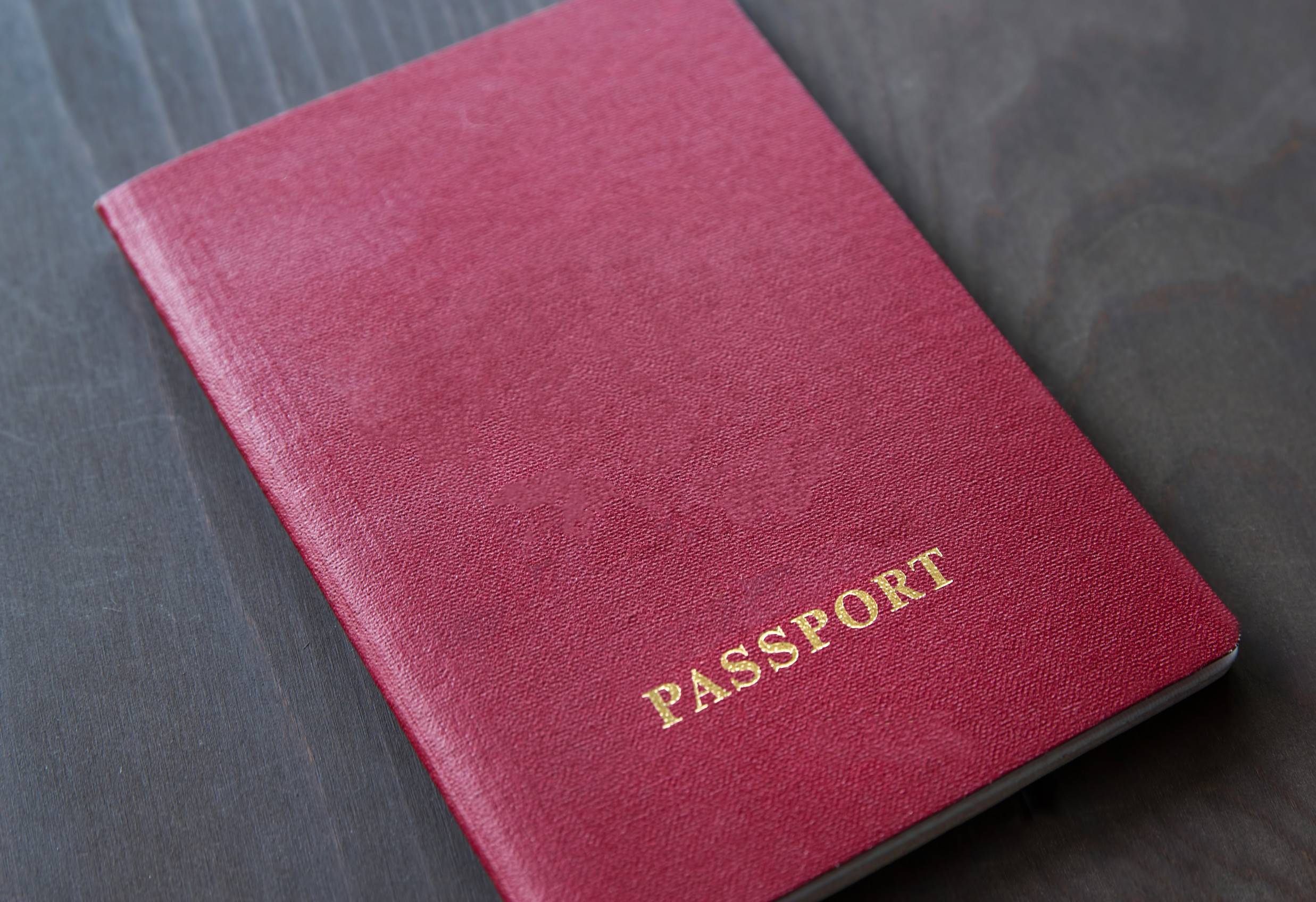Closed Red Passport On Table