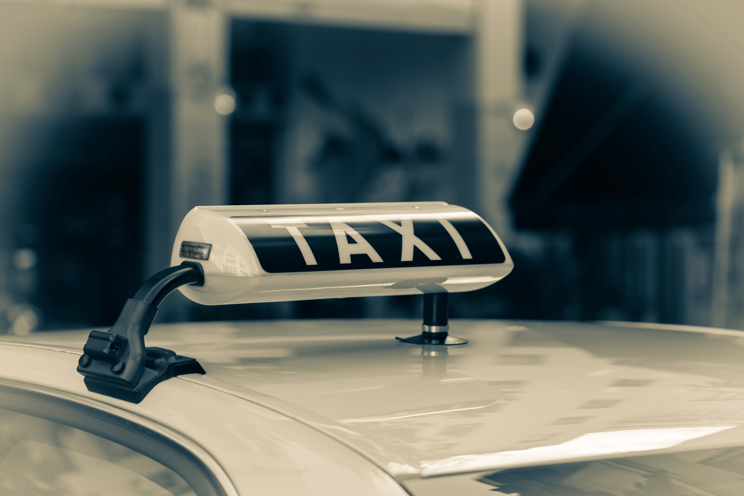 Taxi Sign On Car Roof Sepia Tone